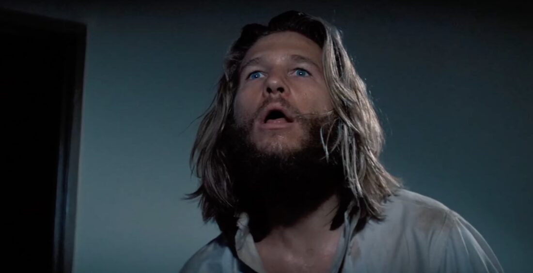 Jack looking stunned in a new york apartment building in King Kong (1976)